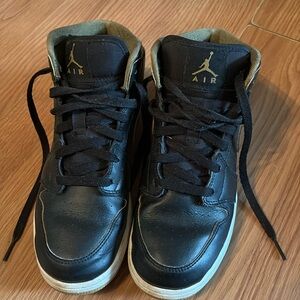 Black and yellow air Jordan sneakers